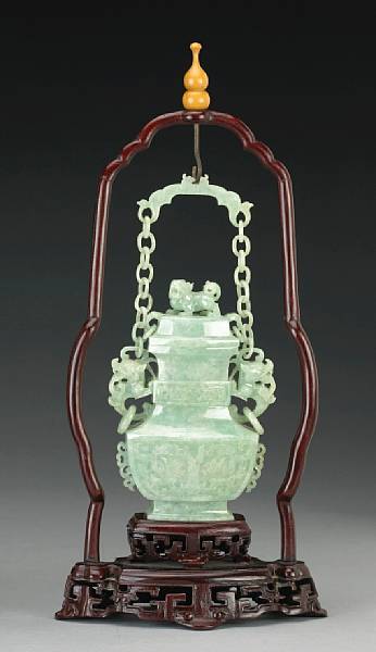 Appraisal: A pale green jadeite covered hanging vase th Century Of