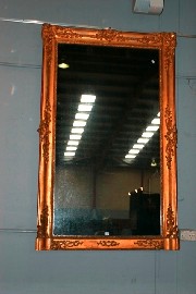 Appraisal: A Rococo style gilt wood and composition overmantel mirror