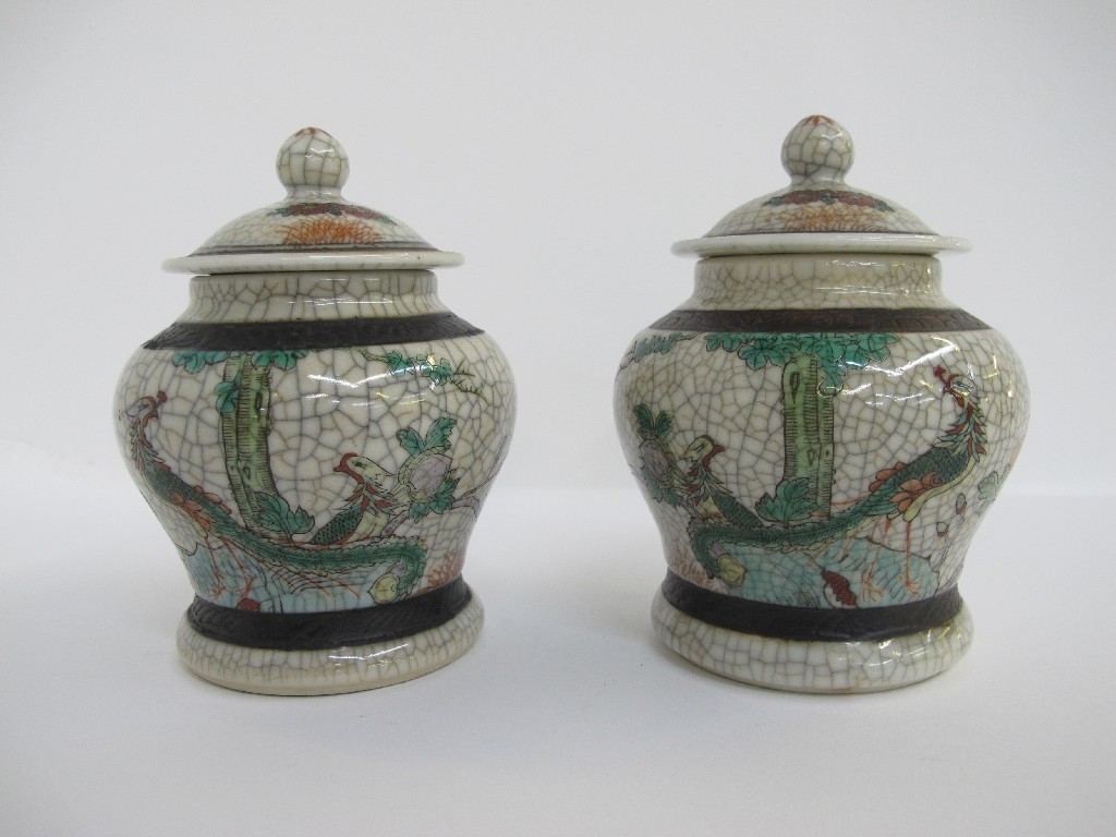 Appraisal: Two Chinese crackleware jars and covers painted with asiatic birds