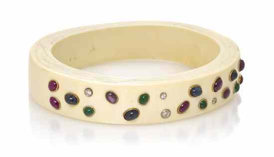 Appraisal: An Ivory Yellow Gold Ruby Sapphire Emerald and Diamond Arm