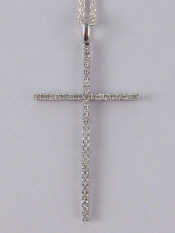 Appraisal: A white metal tests carat gold diamond cross approx x