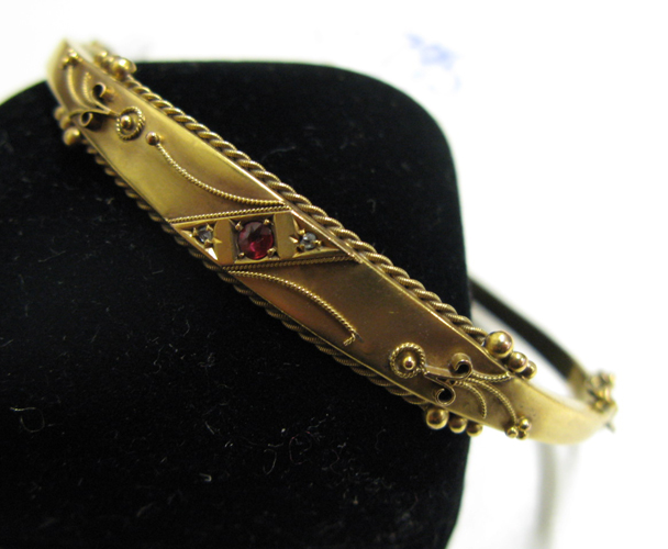 Appraisal: RUBY DIAMOND AND NINE KARAT GOLD BANGLE oval in shape