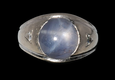 Appraisal: Star sapphire diamond ring central cabochon grayish-blue star sapphire