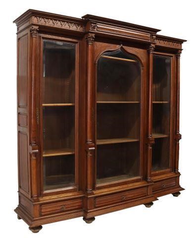 Appraisal: French Gothic Revival oak breakfront bookcase late th c molded