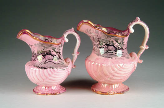 Appraisal: TWO PINK LUSTRE PITCHERS WITH BLACK TRANSFERS Nautilus shell molded