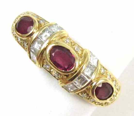 Appraisal: RUBY DIAMOND AND EIGHTEEN KARAT GOLD RING set with three