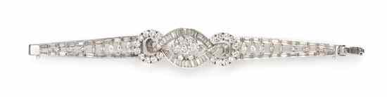 Appraisal: A Platinum and Diamond Bracelet consisting of a central domed