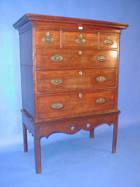 Appraisal: A George III oak chest on stand with moulded top