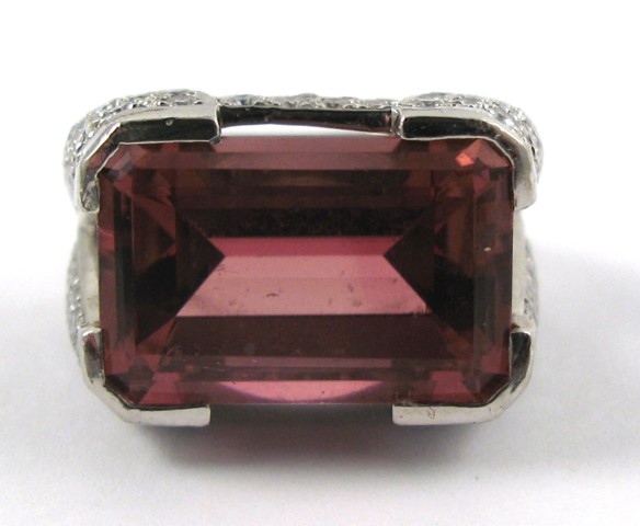 Appraisal: TOURMALINE DIAMOND AND PLATINUM RING centering a rectangular step-cut purplish