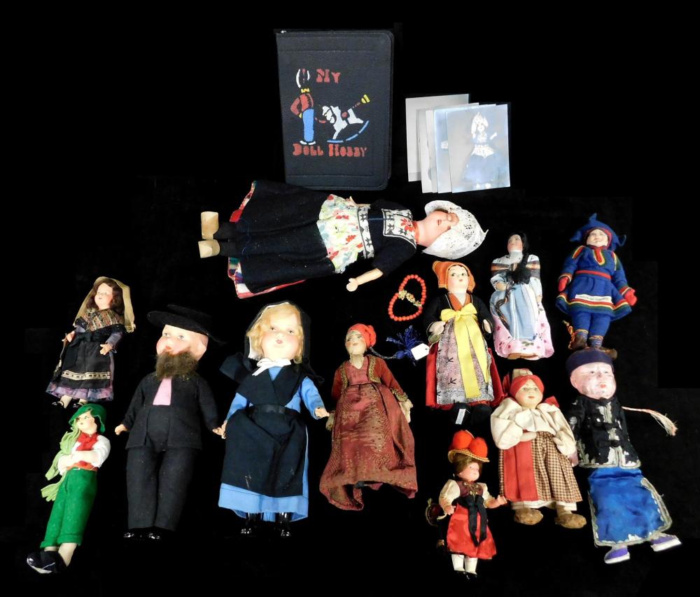 Appraisal: TOYS Fourteen pieces including twelve dolls one book and pictures