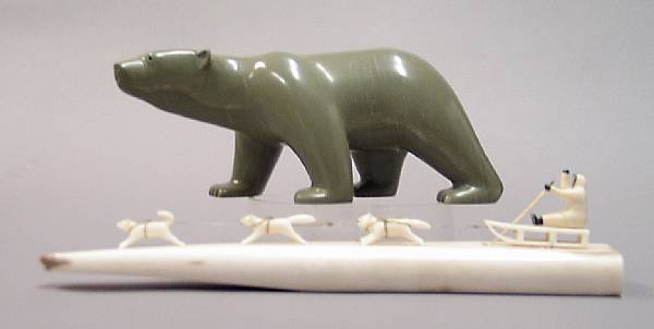 Appraisal: Two Eskimo carvings Including a walrus tusk with dog sled