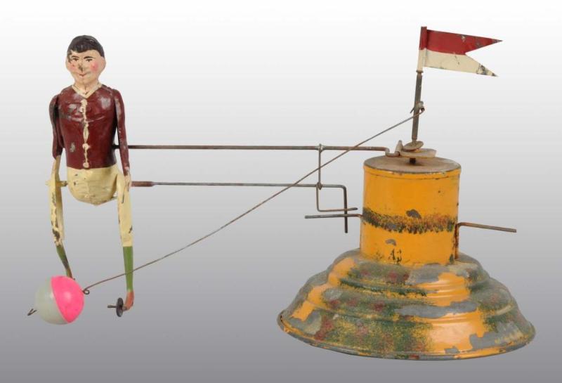 Appraisal: Tin Hand-Painted Boy Kicking Ball Wind-Up Toy Description German Working