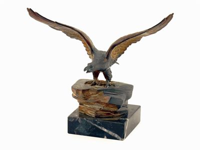 Appraisal: A cold painted lead model of a eagle on a