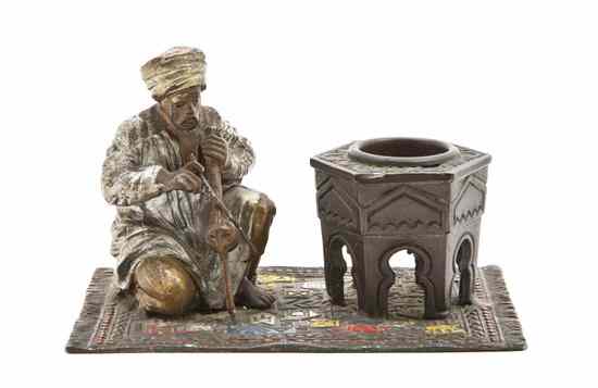 Appraisal: A Cold Painted Cast Metal Orientalist Figure depicting a kneeling