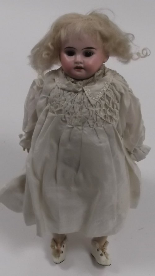 Appraisal: An Armand Marseille small bisque head doll the head impressed