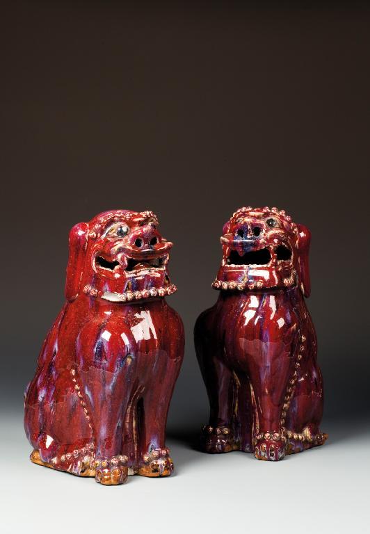 Appraisal: A PAIR OF CHINESE FLAMBE BUDDHISTIC LIONS each beast seated