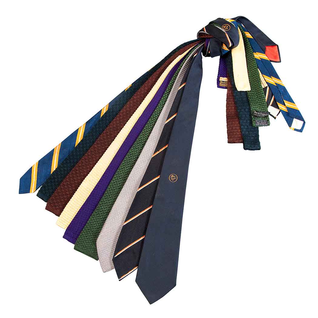 Appraisal: Collection of Nine Neckties Comprising knit insignia and solid ties