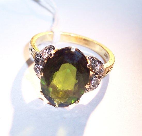 Appraisal: A tourmaline ring the central claw set stone to a