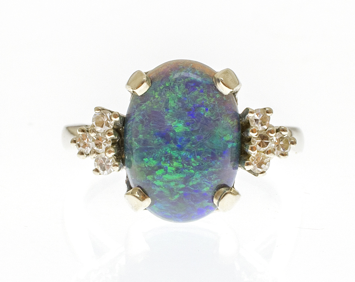 Appraisal: KT WHITE GOLD AND OPAL RING With prong-set oval opal