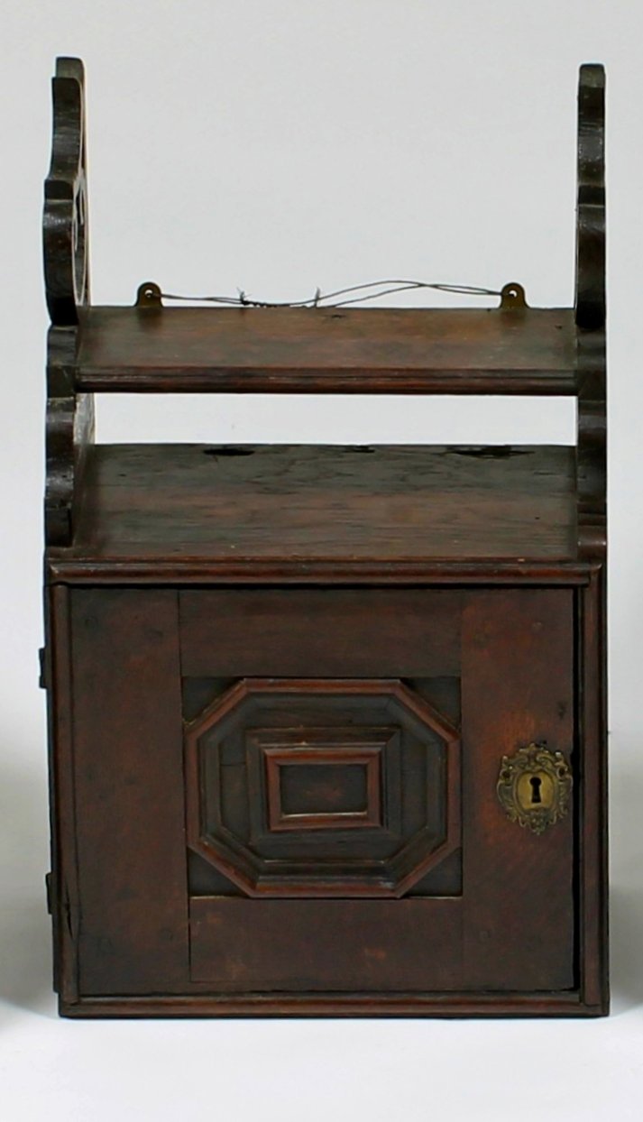 Appraisal: A late th Century oak spice cupboard with integral shelf