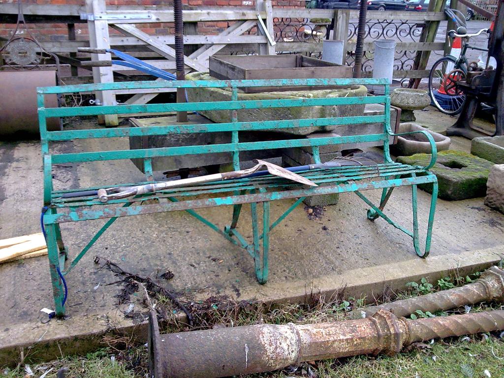 Appraisal: A wrought iron Garden Bench scrolled feet