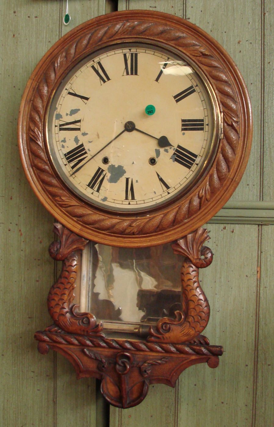 Appraisal: CARVED OAK WALL CLOCK th CenturyWith nautical motif Face needs