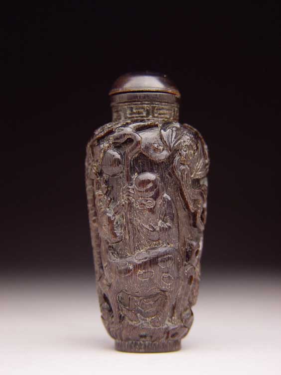 Appraisal: CARVED RHINO SNUFF BOTTLE Well carved rhinoceros horn snuff bottle