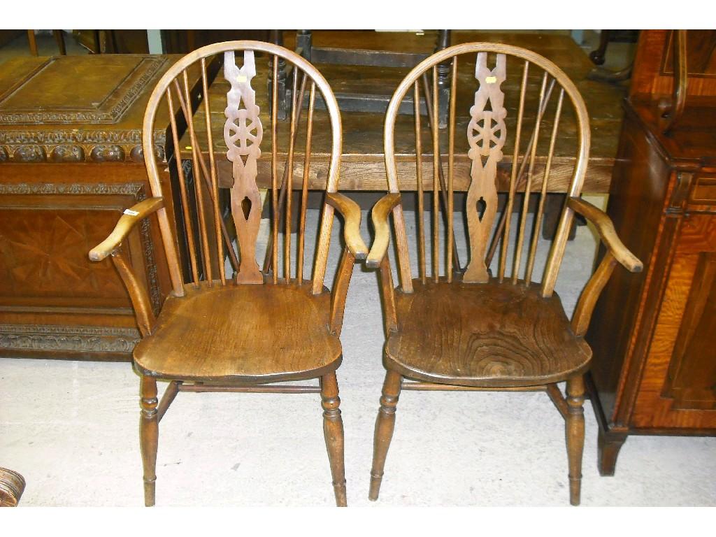 Appraisal: Matched pair of elm seat Windsor wheelback armchairs with traditional