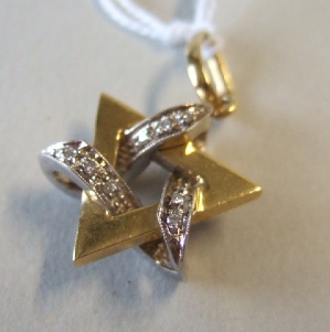 Appraisal: An Italian gold and diamond set pendant in a triangular