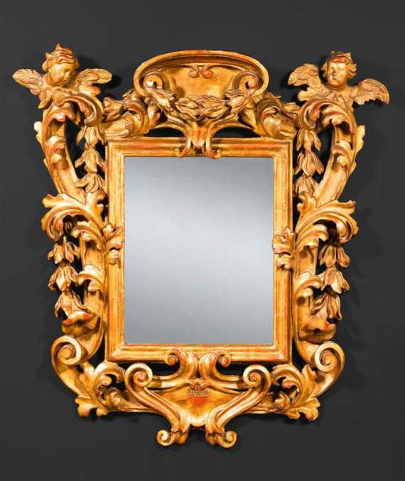 Appraisal: MIRROR AUX ANGELOTS Baroque northern Italy circa Pierced richly carved