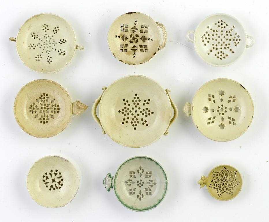 Appraisal: NINE WEDGWOOD AND OTHER CREAMWARE EGG DRAINERS AND STRAINERS one