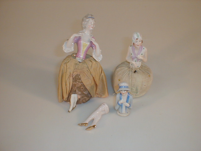 Appraisal: Two German porcelain half doll pin cushions one as an