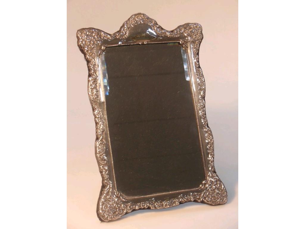 Appraisal: A modern silver framed easel mirror with a rectangular bevelled