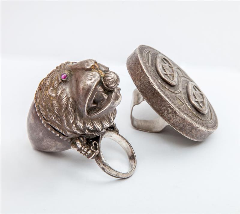 Appraisal: TWO SILVERED METAL RINGS The one modeled as a lion