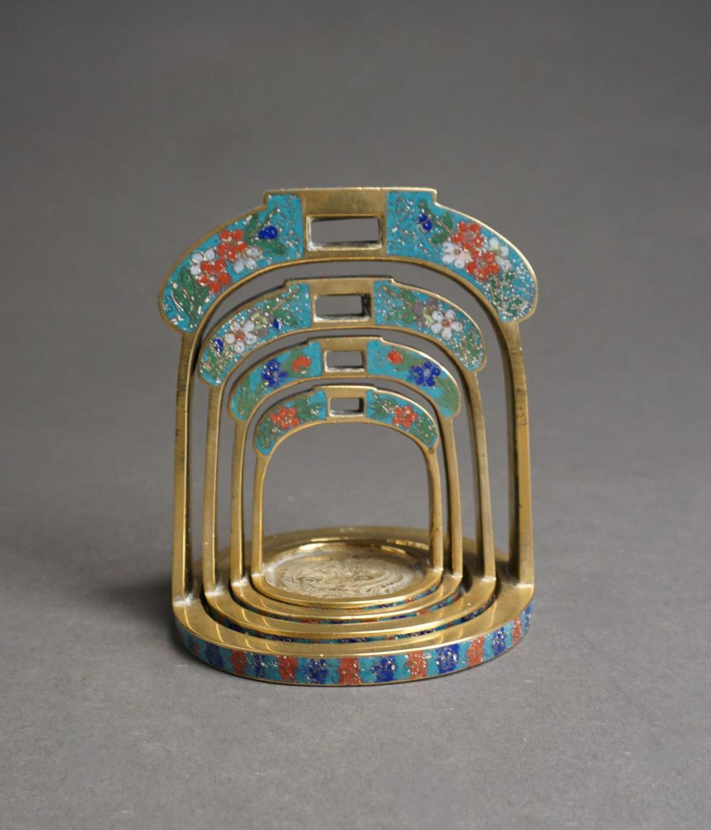 Appraisal: NEST OF FOUR CHINESE CHAMPLEVE AND BRASS STIRRUP-FORM STANDSNest of