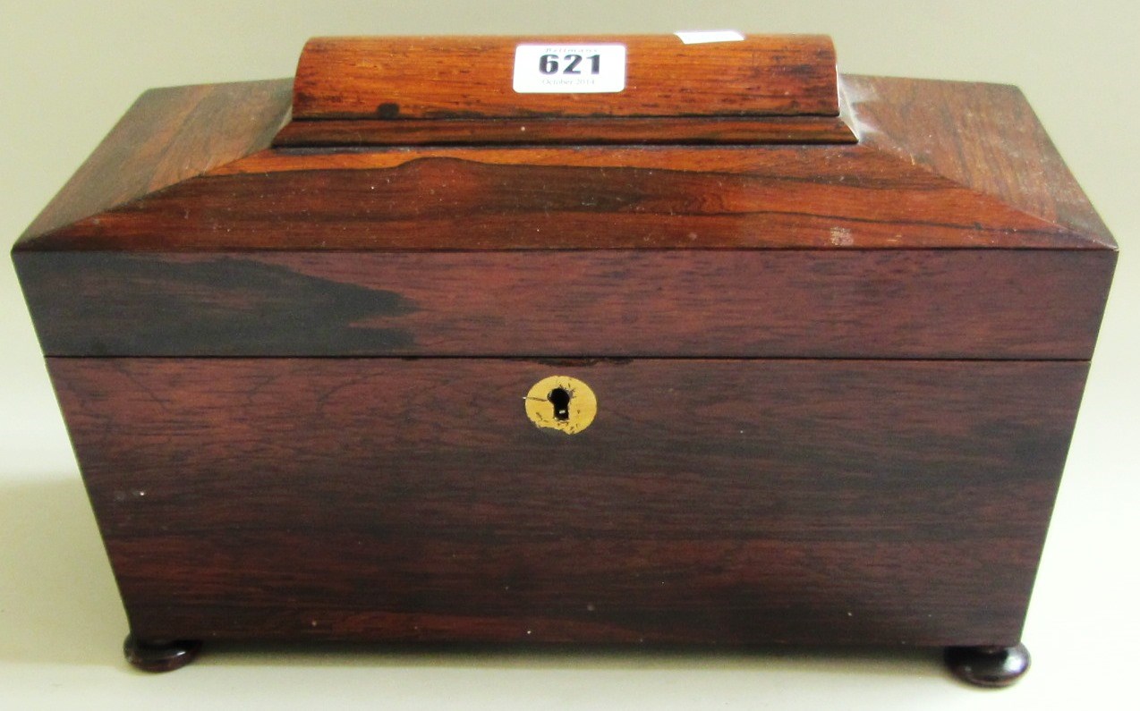 Appraisal: A Regency rosewood sarcophagus tea caddy with twin lidded interior