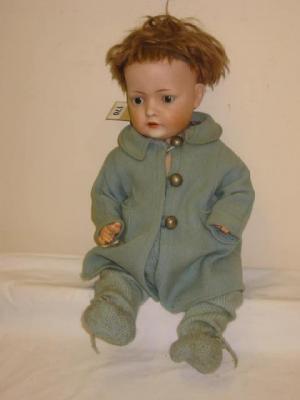 Appraisal: A Bruno Schmidt bisque head boy doll with brown sleeping