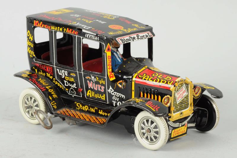 Appraisal: Marx Toys Tin Litho Old Jalopy Wind-Up Toy Has driver