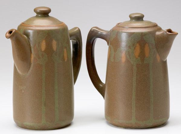 Appraisal: WALRATH Two chocolate pots matte-painted with full-height trees dangling orange