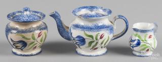 Appraisal: Miniature blue spatter teapot sugar and creamer with blue tulip