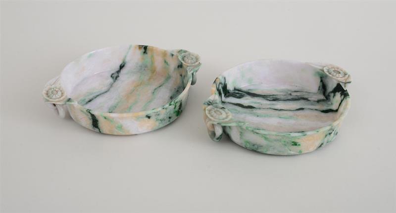 Appraisal: PAIR OF CHINESE CARVED JADE TWO-HANDLED BOWLS Each with everted