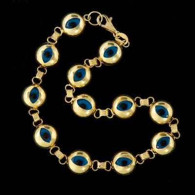 Appraisal: A Gold and Glass Evil Eye Bracelet k yellow gold