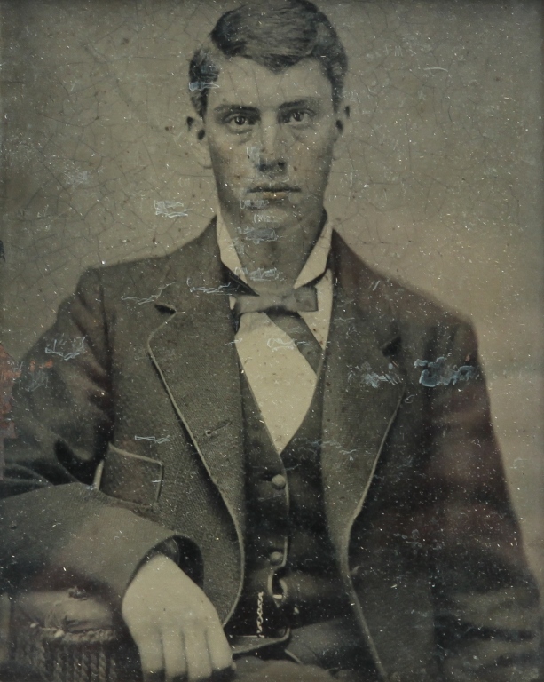 Appraisal: AMERICAN TINTYPE OF YOUNG MAN Late th century Seated man