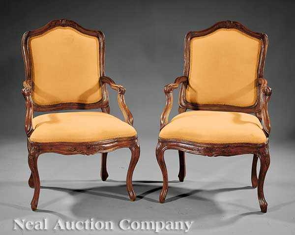 Appraisal: A Pair of Louis XV Fruitwood Fauteuils th c arched