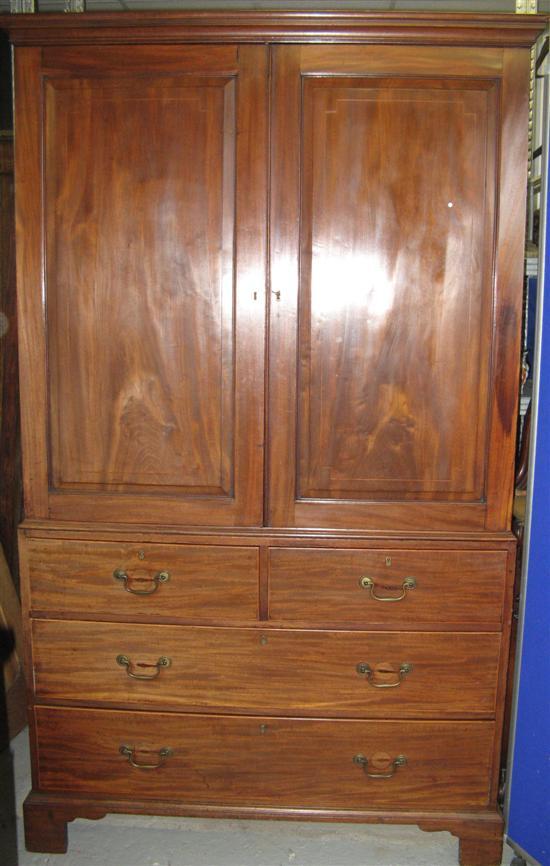 Appraisal: George III mahogany linen press with line inlaid panelled doors