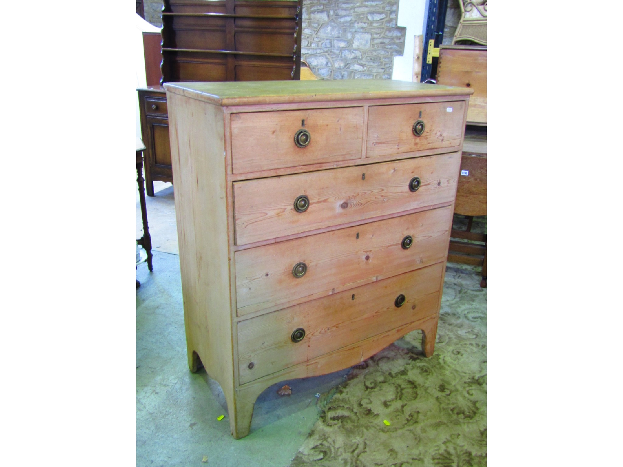 Appraisal: A th century stripped pine bedroom chest of three long