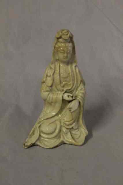 Appraisal: A CHINESE BLANC DE CHINE MODEL OF GUANYIN holding a