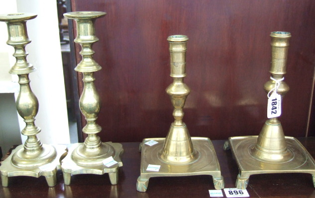 Appraisal: A pair of Spanish brass candlesticks th century each with