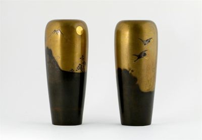 Appraisal: A pair of Japanese bronze vases subtly decorated with shaded