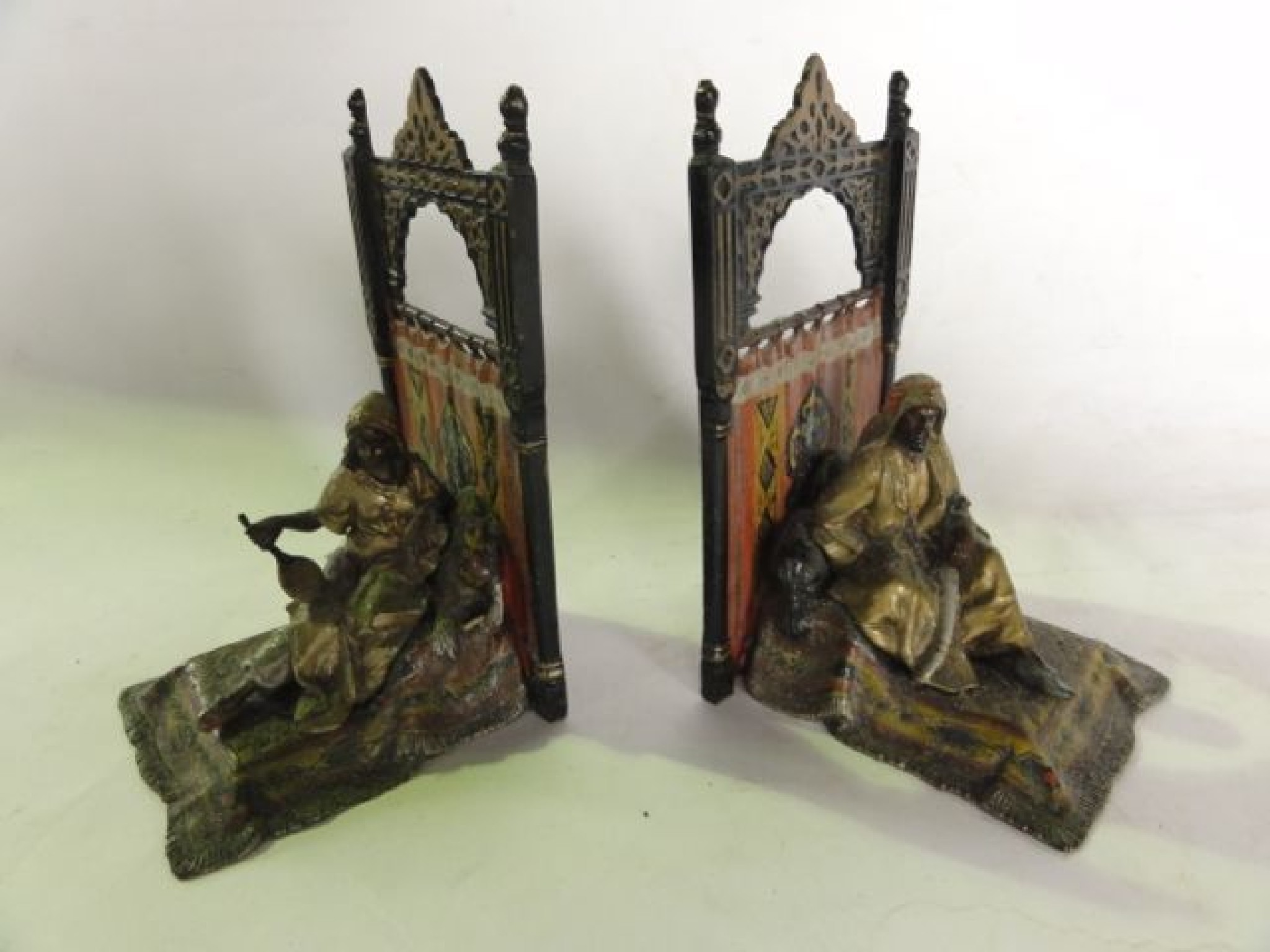 Appraisal: A pair of painted cast metal bookends one in the